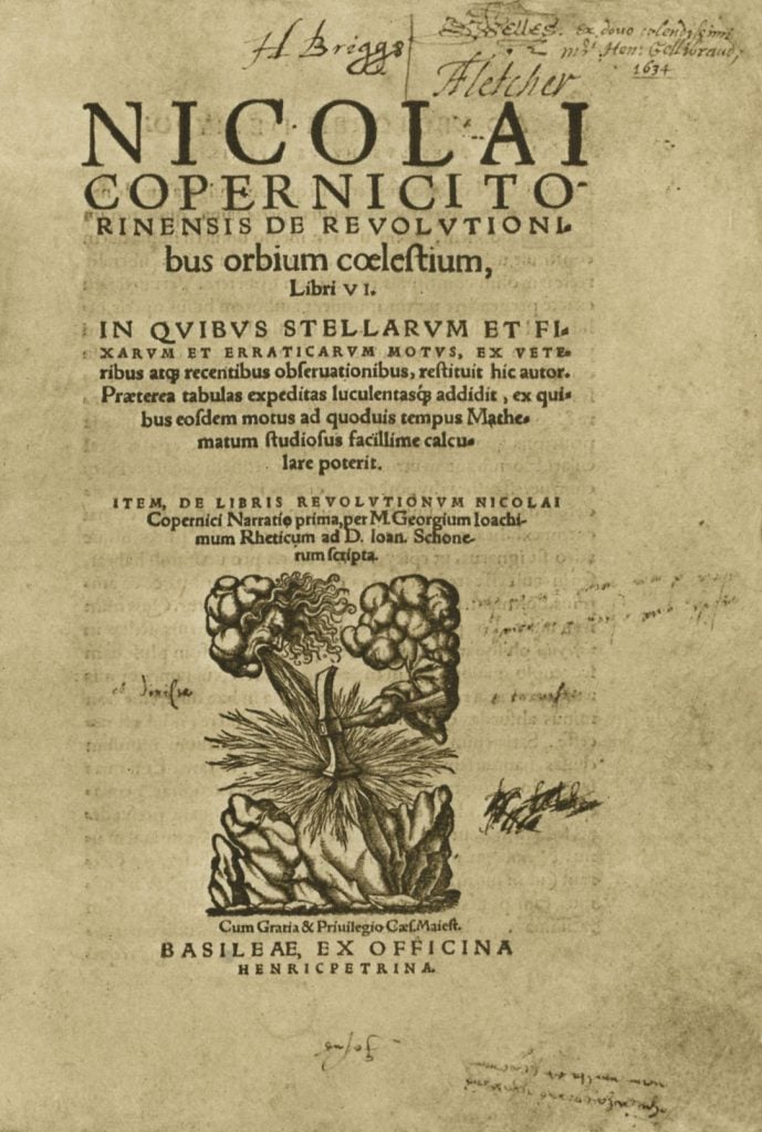 A yellowed title page that reads "De Revolutionibus Orbium Coelestium"