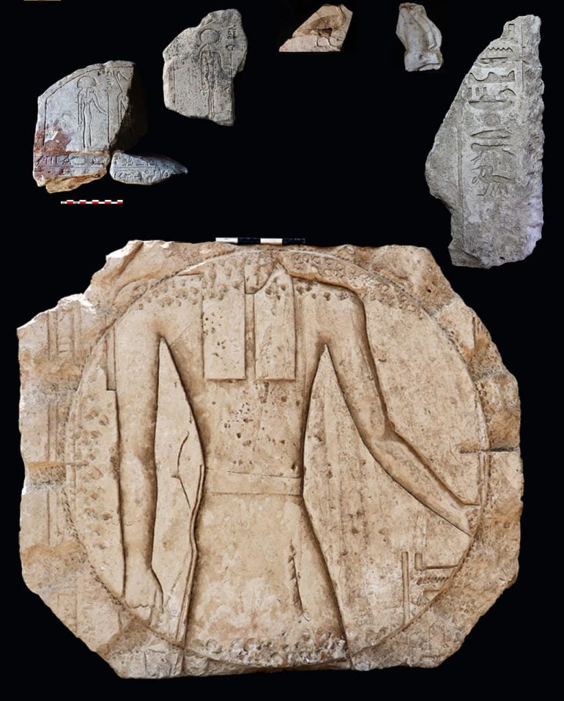 A group of ancient stone artifacts laid out against a black background