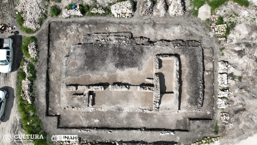 an aerial photograph showing the lay out of one of the Mayan buildings with walls in an 'L' shape clearly visible