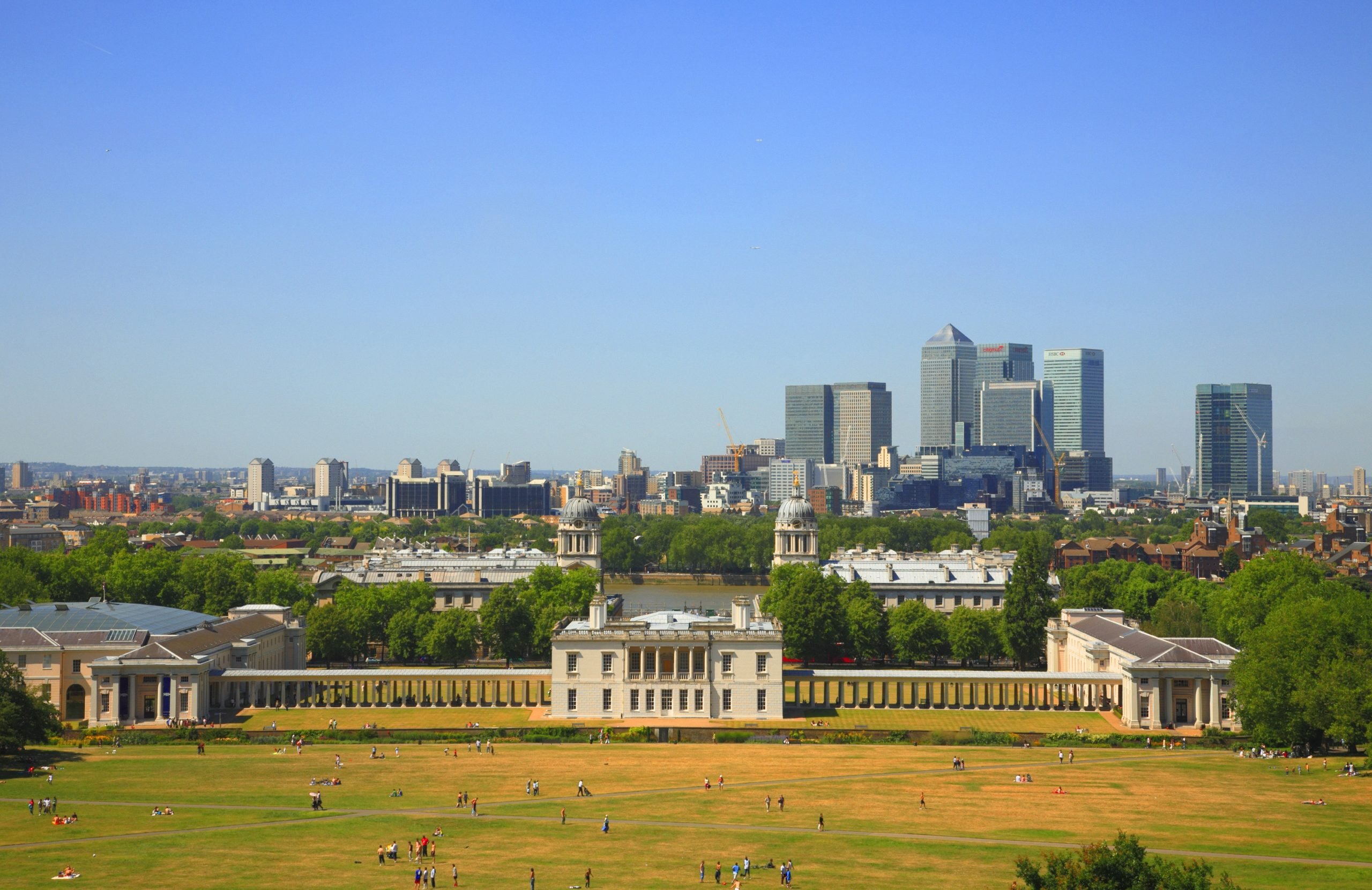 View of a 17th-century naval college against a backdrop of high-rises on the London riverside