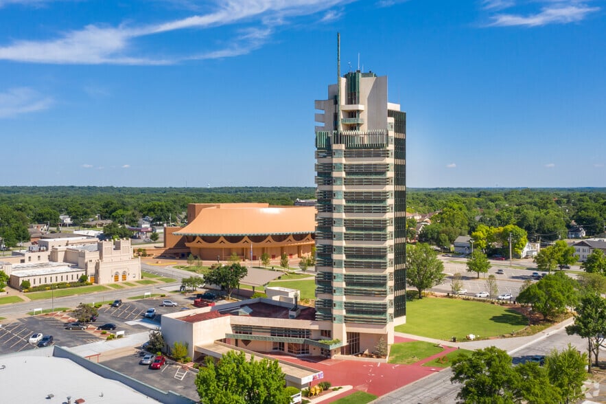 aerial photo of Price Tower with a blue sky background