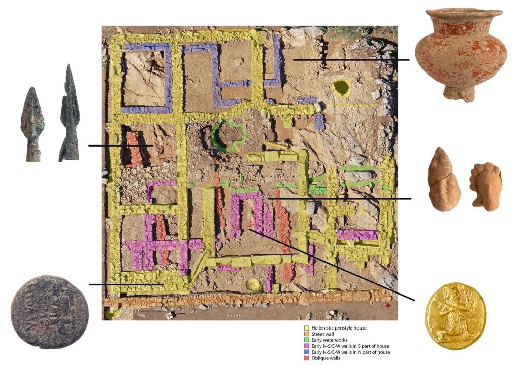 An aerial view of an ancient house, with arrows showing where artifacts such as coins and pottery were found