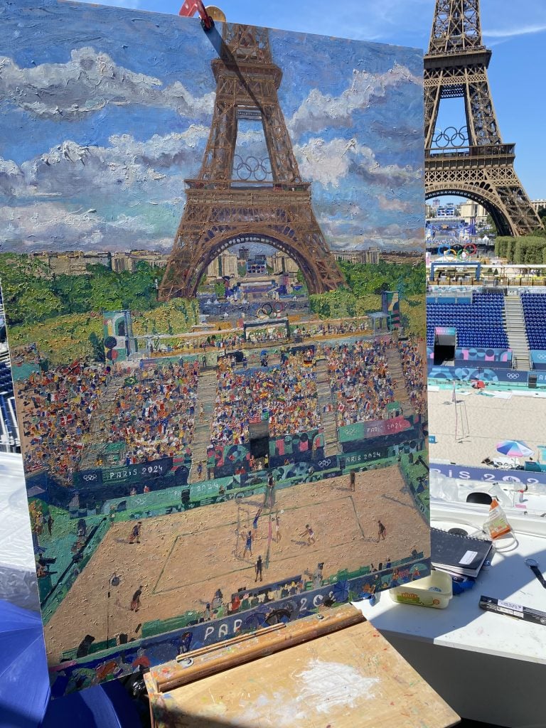 Peter Spens's completed painting of the Olympic beach volleyball tournament, with a view of the Eiffel Tower.