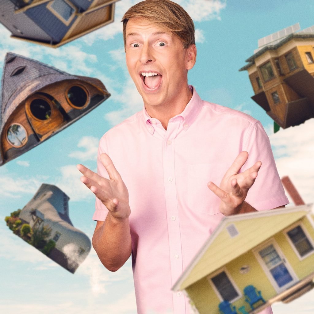 Actor and comedian Jack McBrayer, surrounded by floating houses