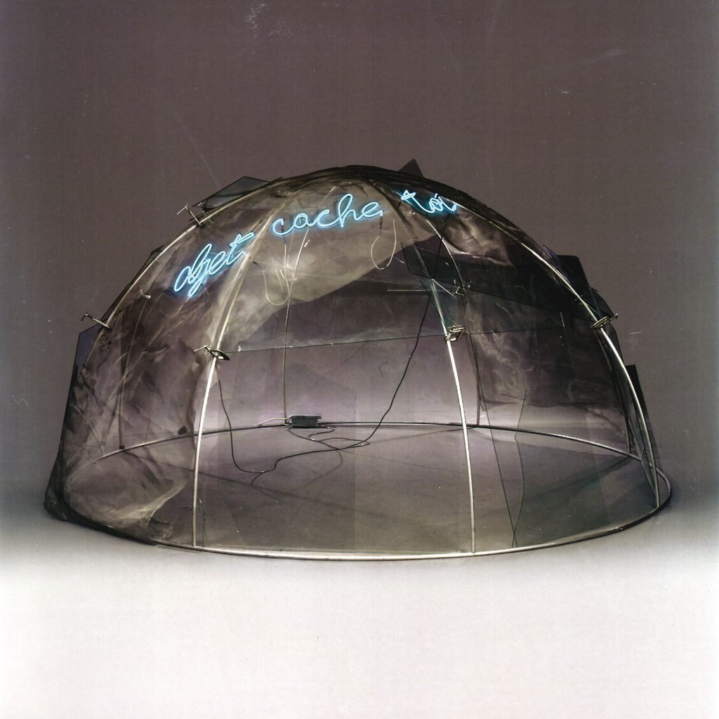 artwork consisting of an igloo made from metal and wire with a neon light