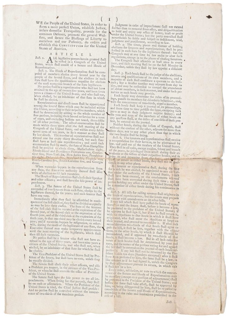 a long sheet of paper showing a rare copy of the U.S. constitution 