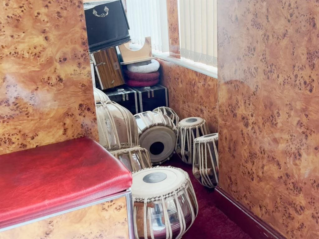 room with drums stacked in a corner