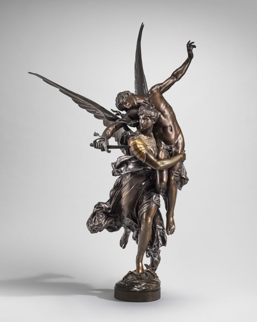 A sculpture of showing a winged female allegorical image of Fame carrying to glory a dying French hero