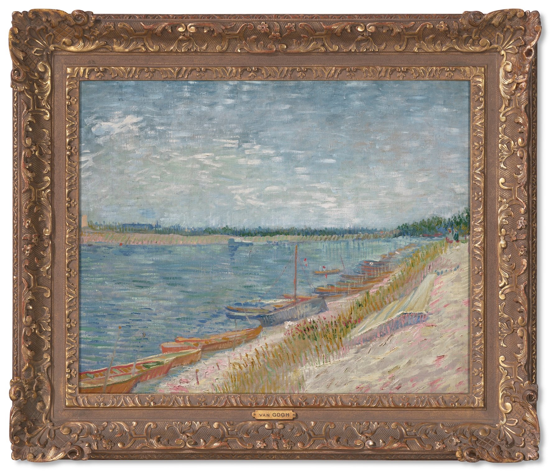 This image shows a framed painting of a river side with boats parked by the shore