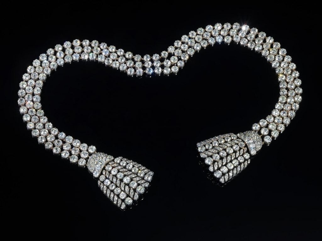 the diamond necklace on a black background