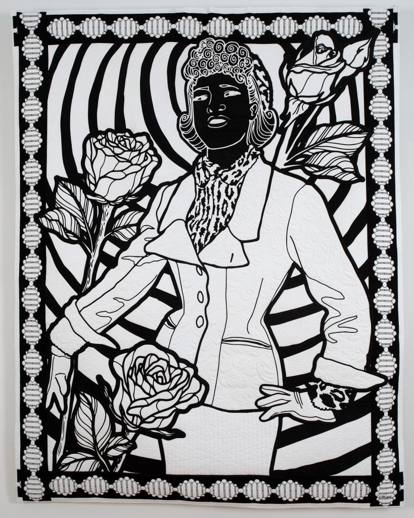 Carolyn Mazloomi, The Immortal Legacy of Henrietta Lacks. A black and white art quilt depicting an African American woman whose cancer cells became—without her consent—the first immortalized human cell line, used to this day in biomedical research. She is depicted with stylish curls wearing a fashionable suit, surrounded by three larger than life roses, on a background of concentric circles with a geometric border.