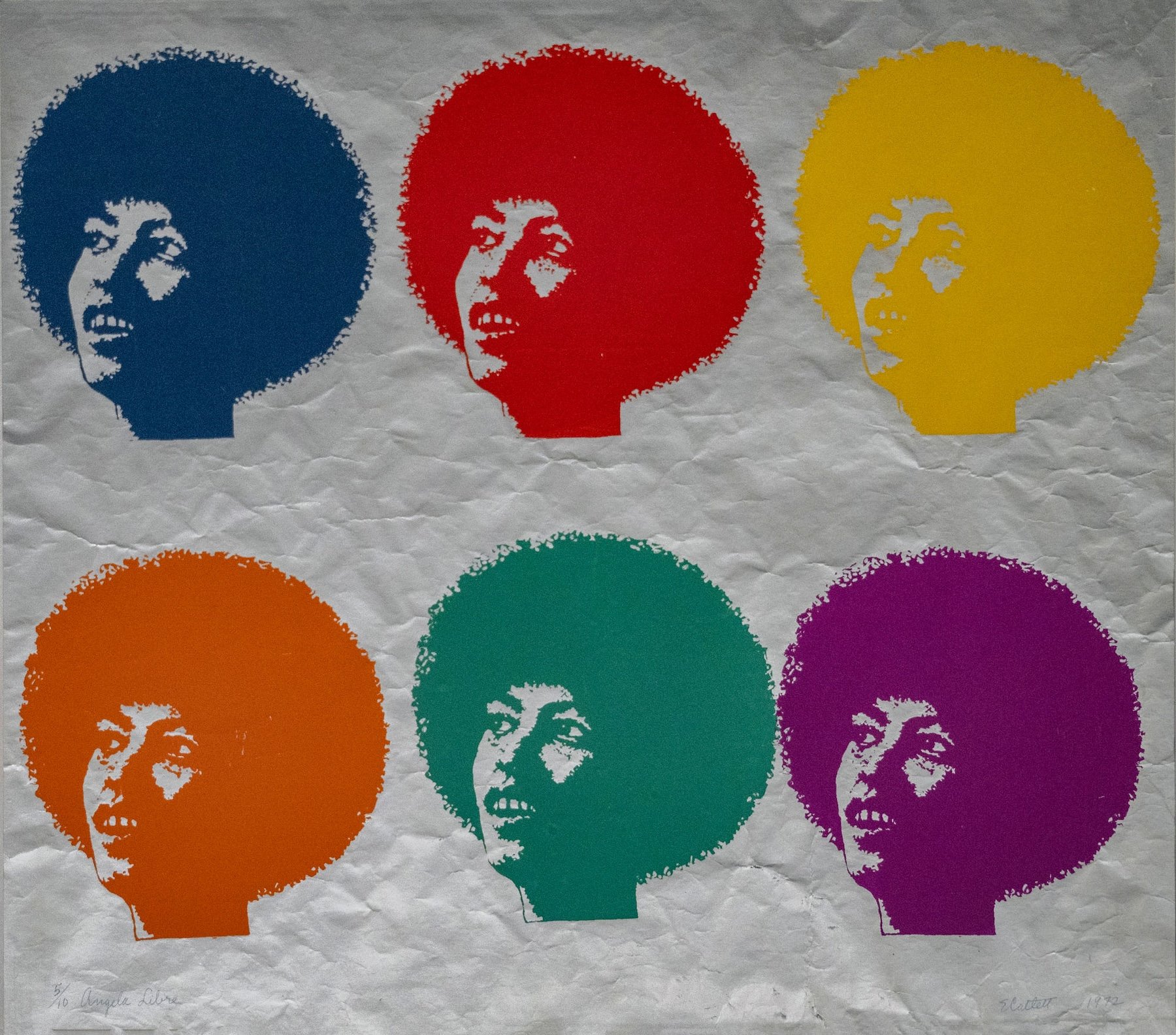 An image of a woman's face repeated six times in blue, red, yellow, orange, green, and purple