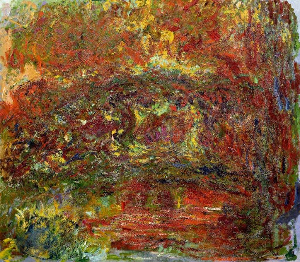 an almost abstract painting of a japanese bridge by Monet, in bright reds and yelllows