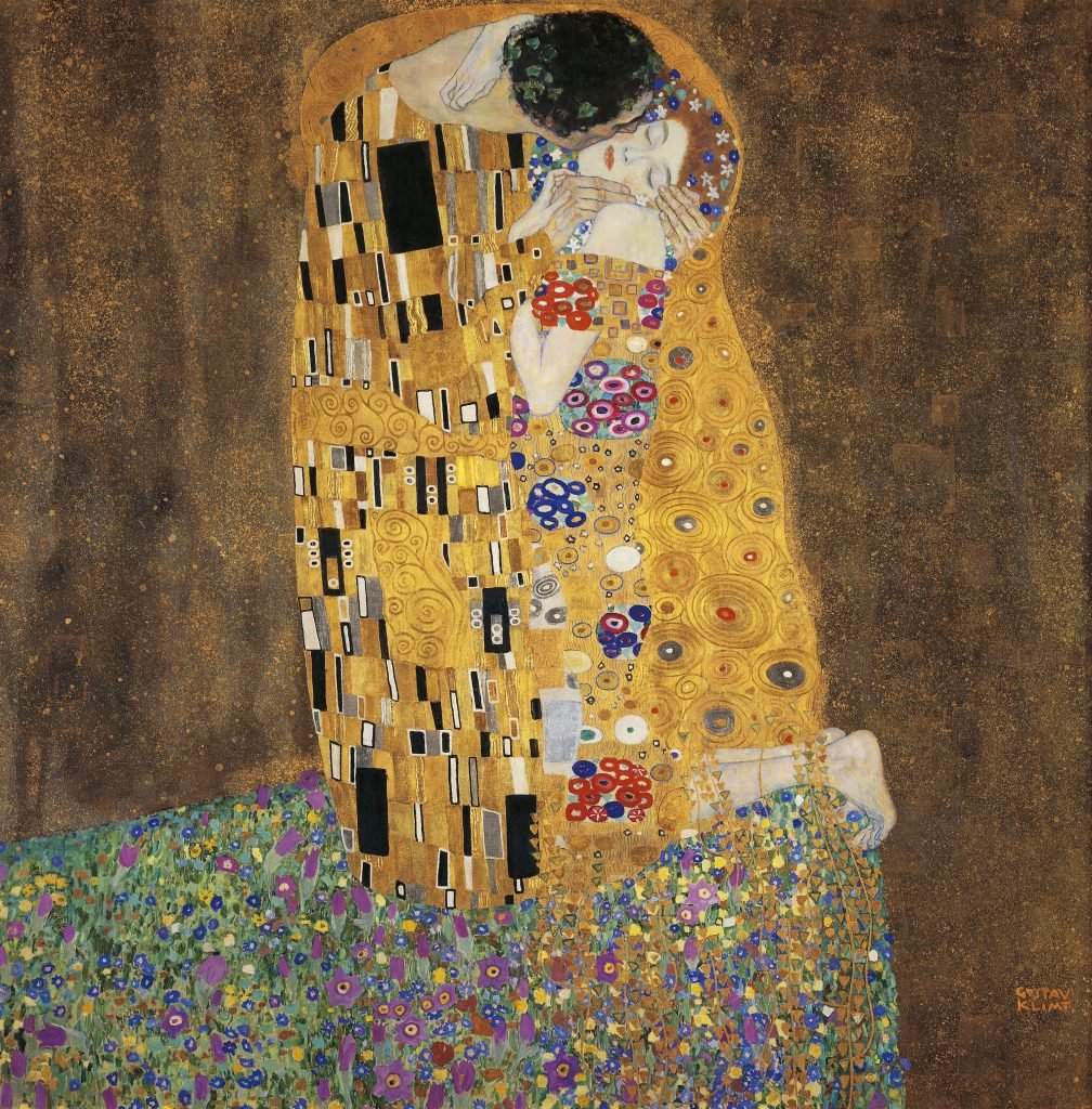 a gold-adorned painting of a man and a woman embracing. the background is a glittering cosmos-like background