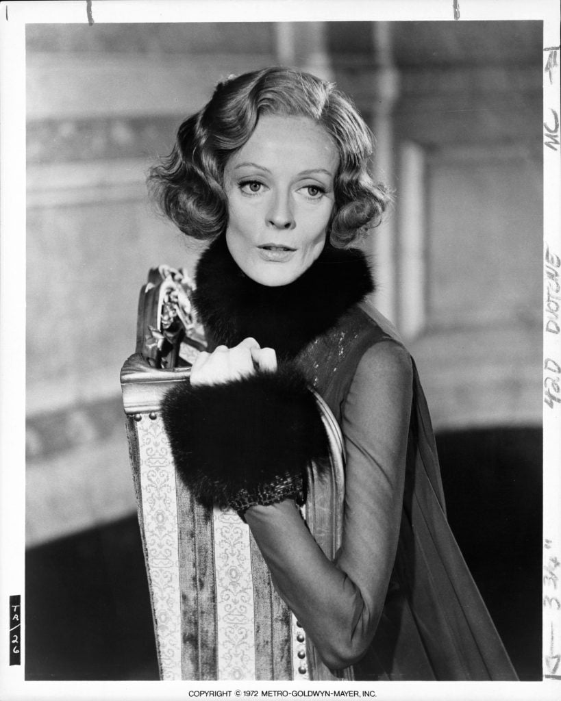 an archival black and white photo of actress maggie smith in a 1972 film