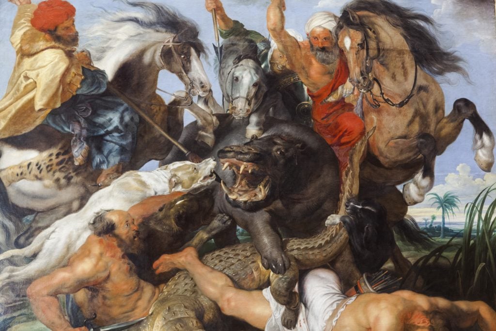 a painting in which there are men wearing turbans on horseback trying to spear a very ferocious looking hippo that is also being attacked by a dog, underneath his legs are a crocodile and a dead body of man