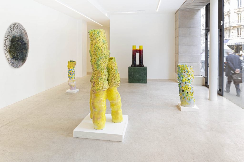 a light and spacious gallery is gilled with colorful modern ceramic sculptures