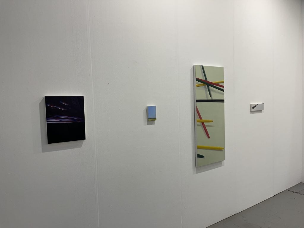 Spare paintings on a wall with geometric shapes