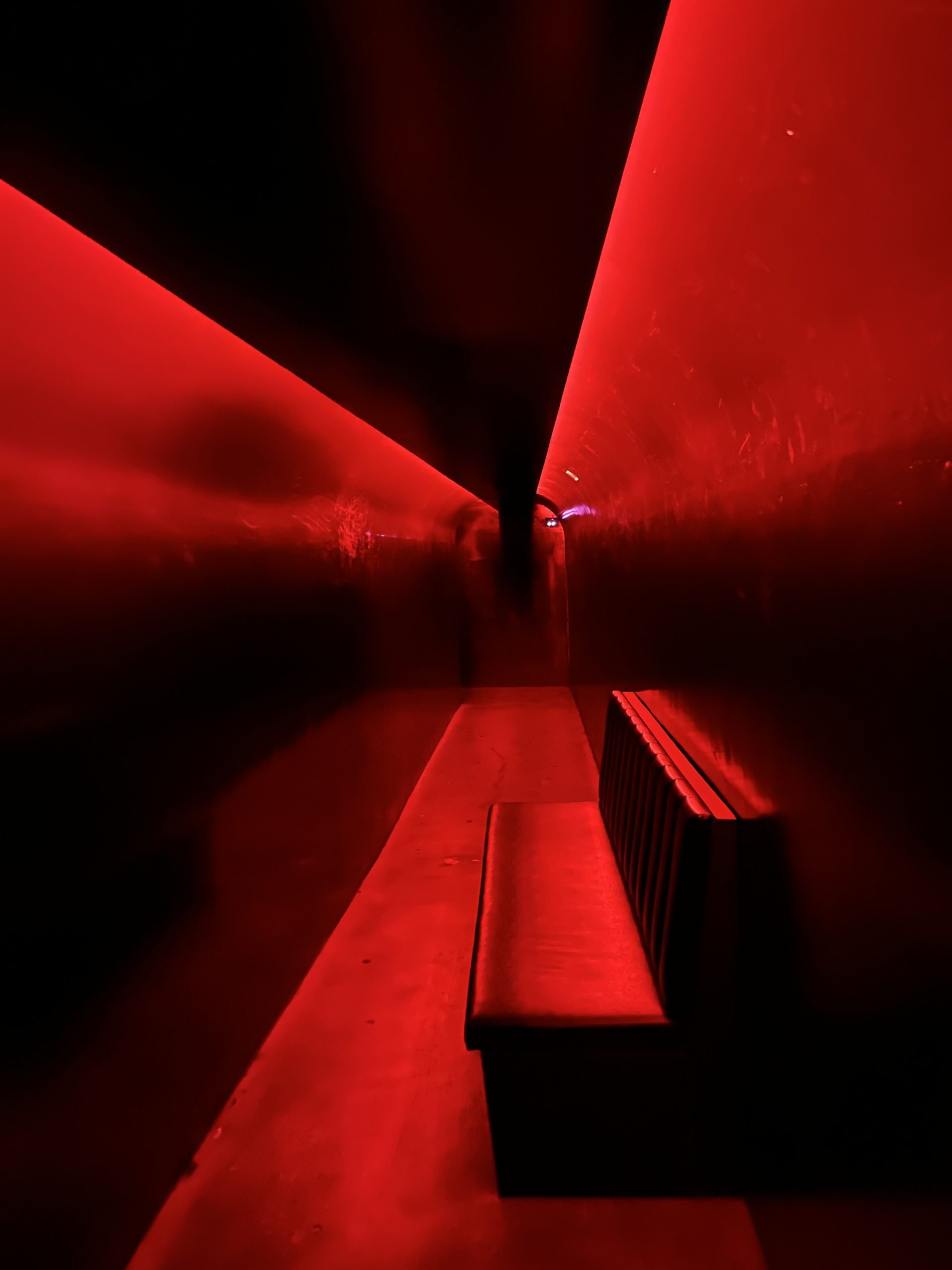 A hallway with red and black