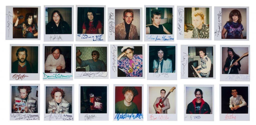 a group of Polaroids in a grid showing celebrity faces with signatures beneath