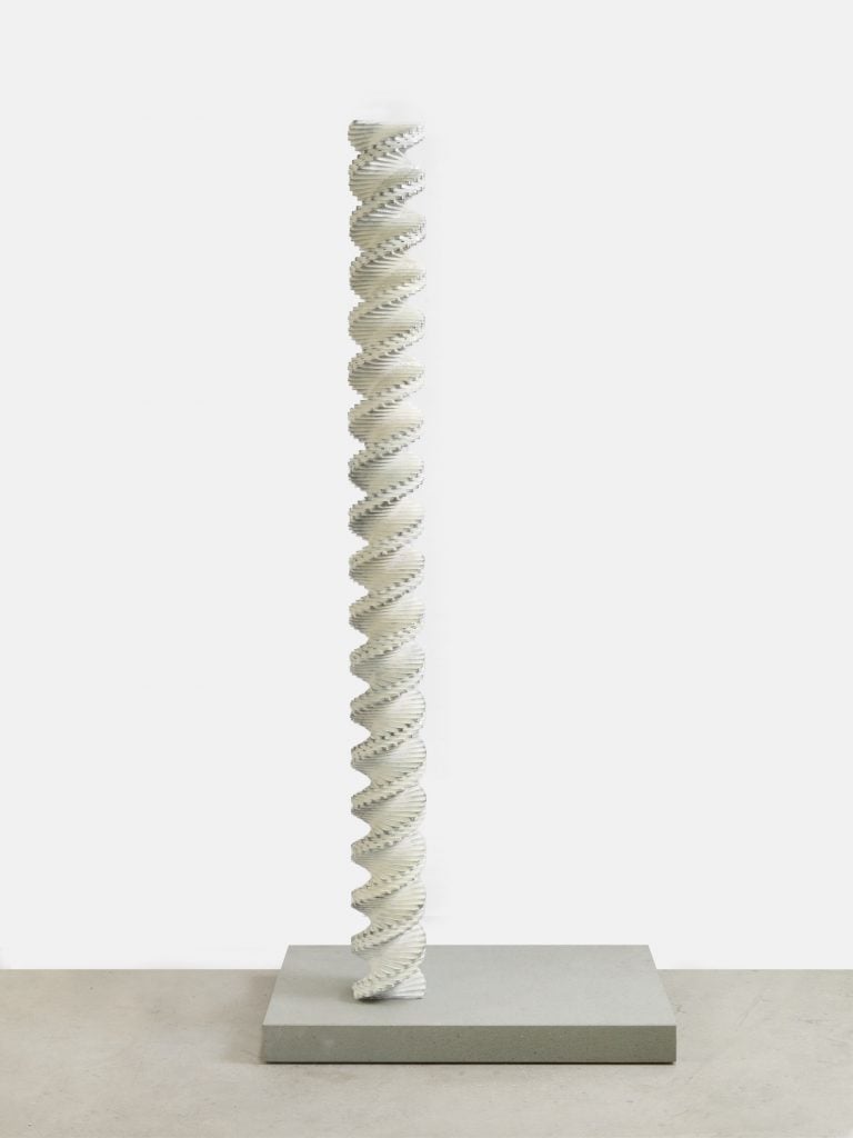 an image of a tall white spiral column resting on a plinth