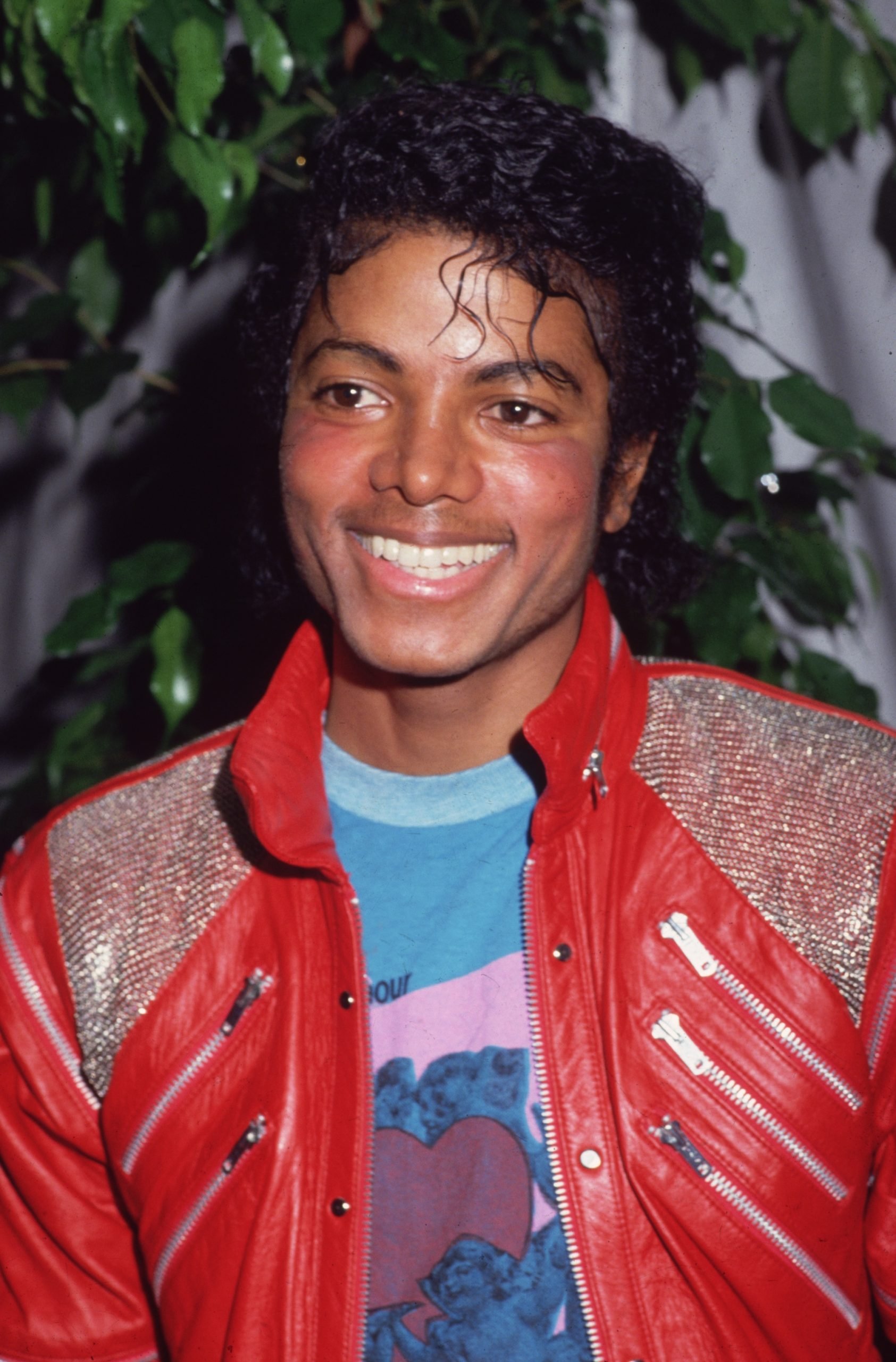 an image of Michael Jackson wearing a red leather jacket