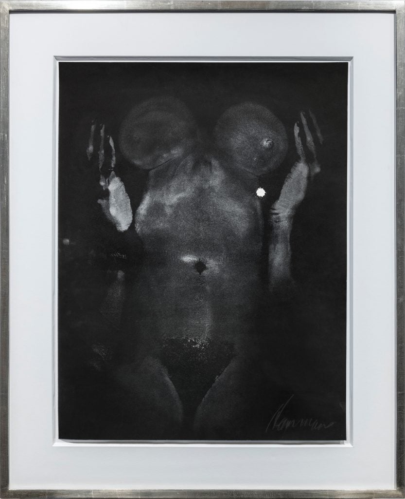 a black and white image of a female nude