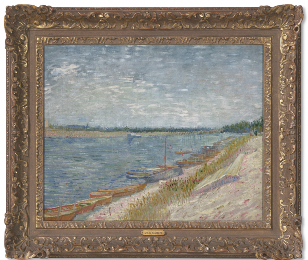 a van gogh riverscape in a gold frame