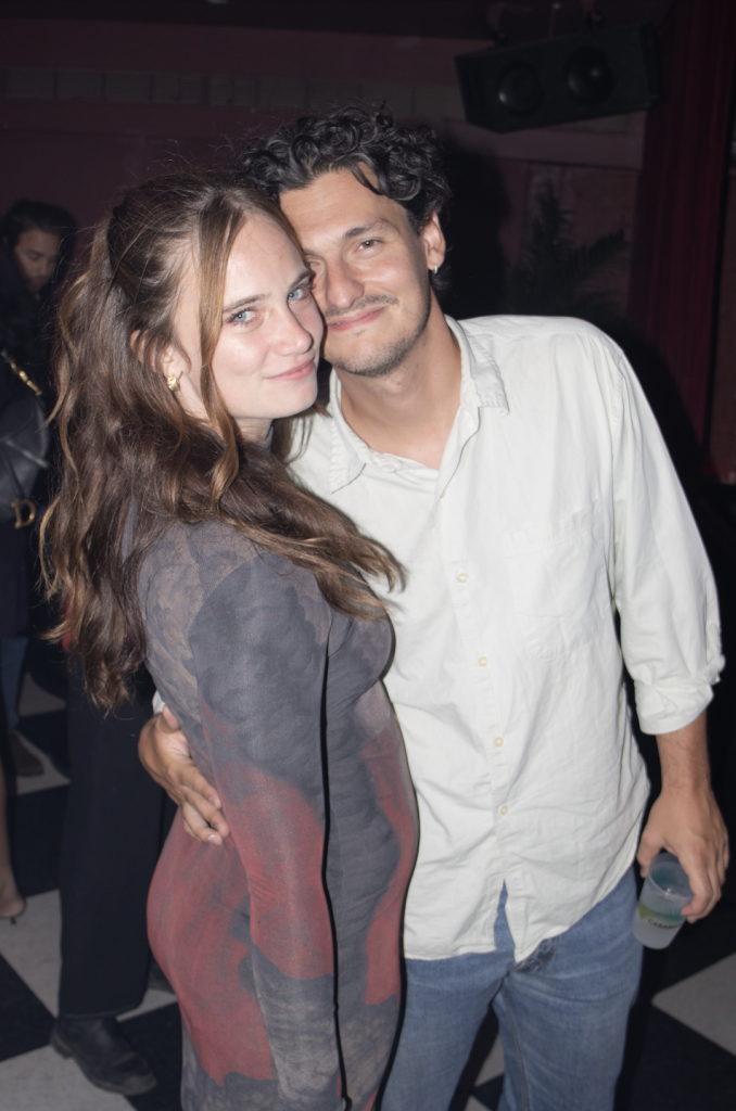 A photograph of Annie Armstrong embracing a man in a white shirt