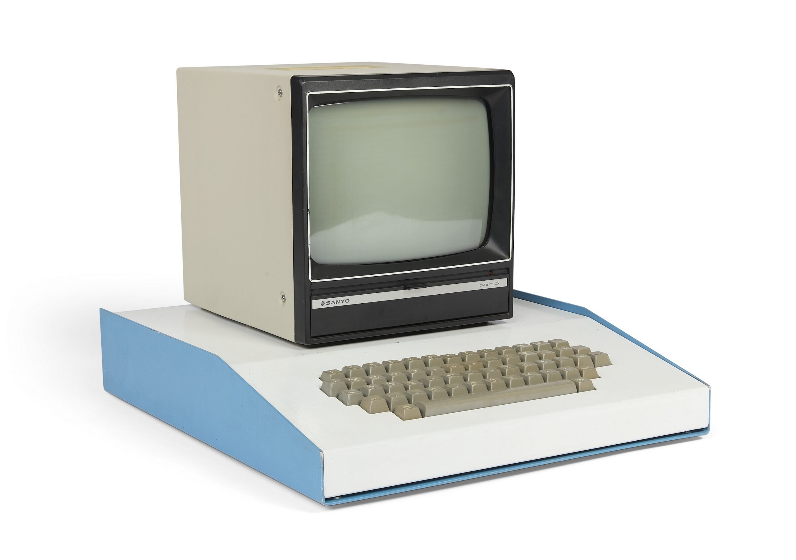 a computer on a white background, it has a built in keyboard and monitor