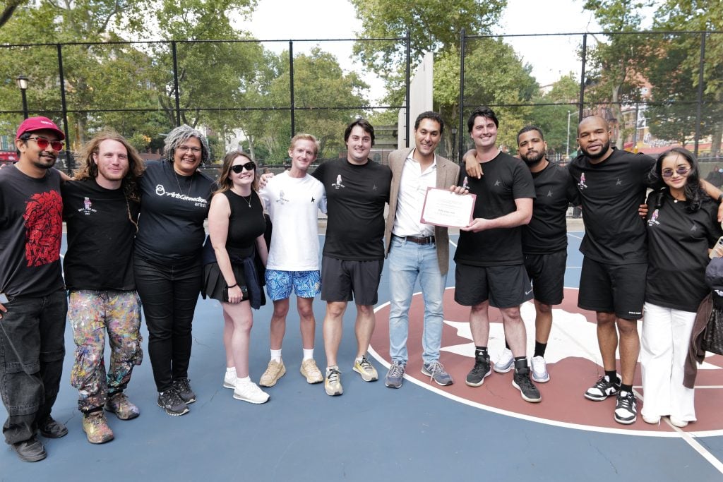 A photograph of the organizers and nonprofits behind Ball For Art, pictured on a basketball court.