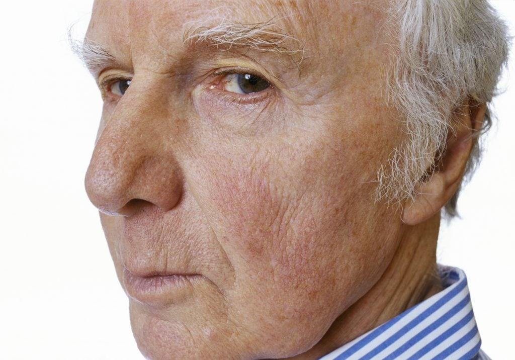 A close up of a man's face giving the side eye