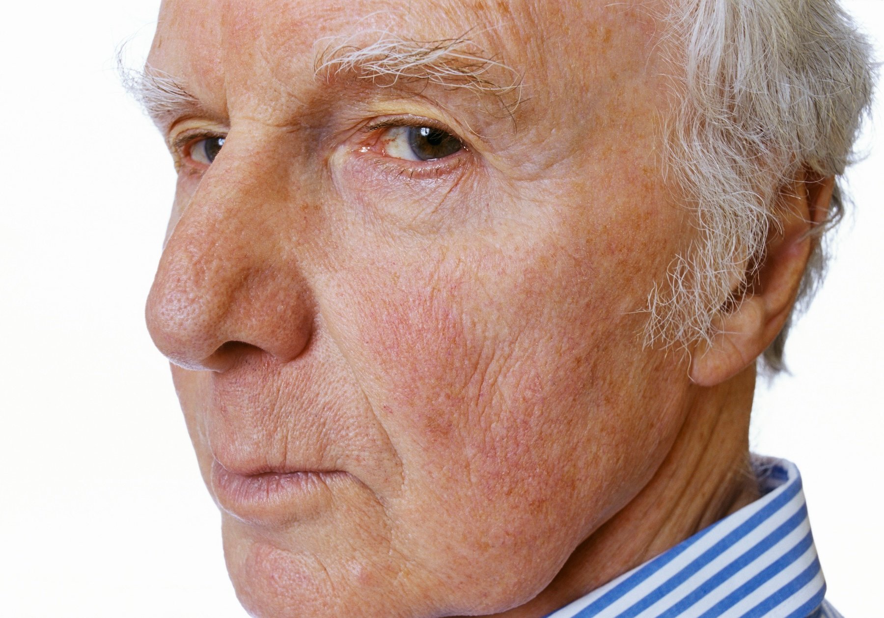 A close up of a man's face giving the side eye