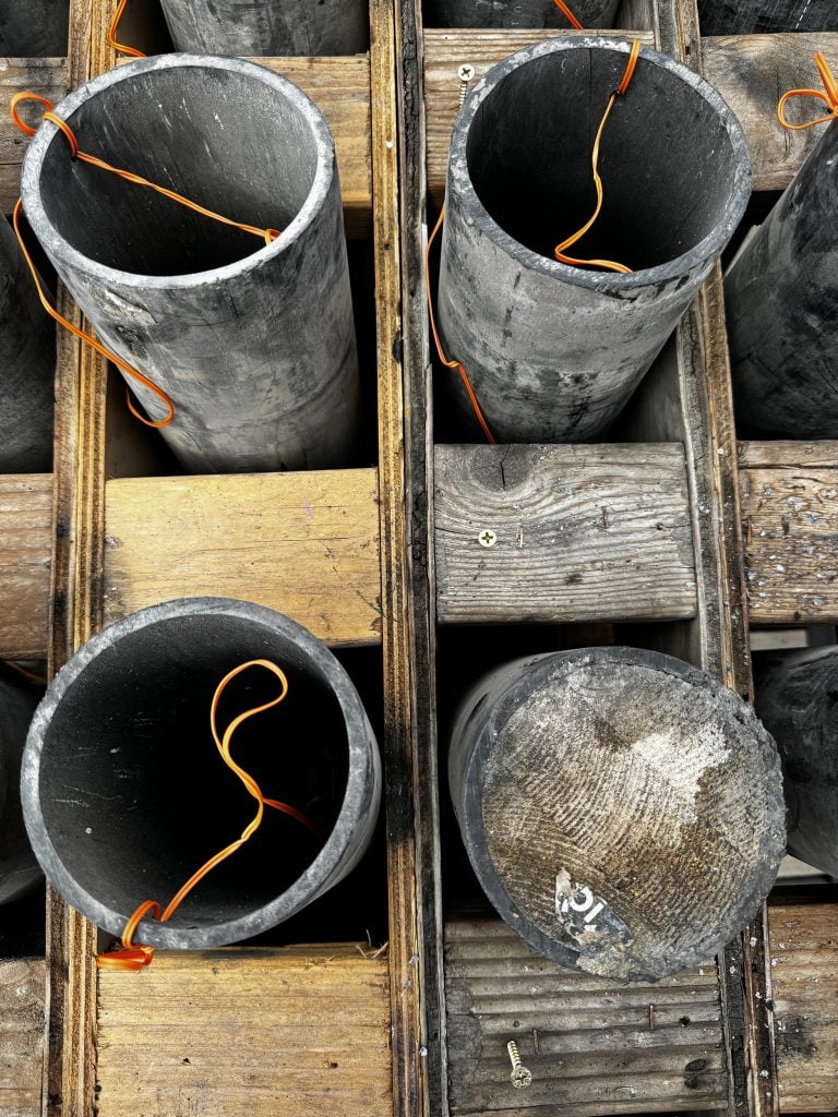 A closeup of four mortar shells