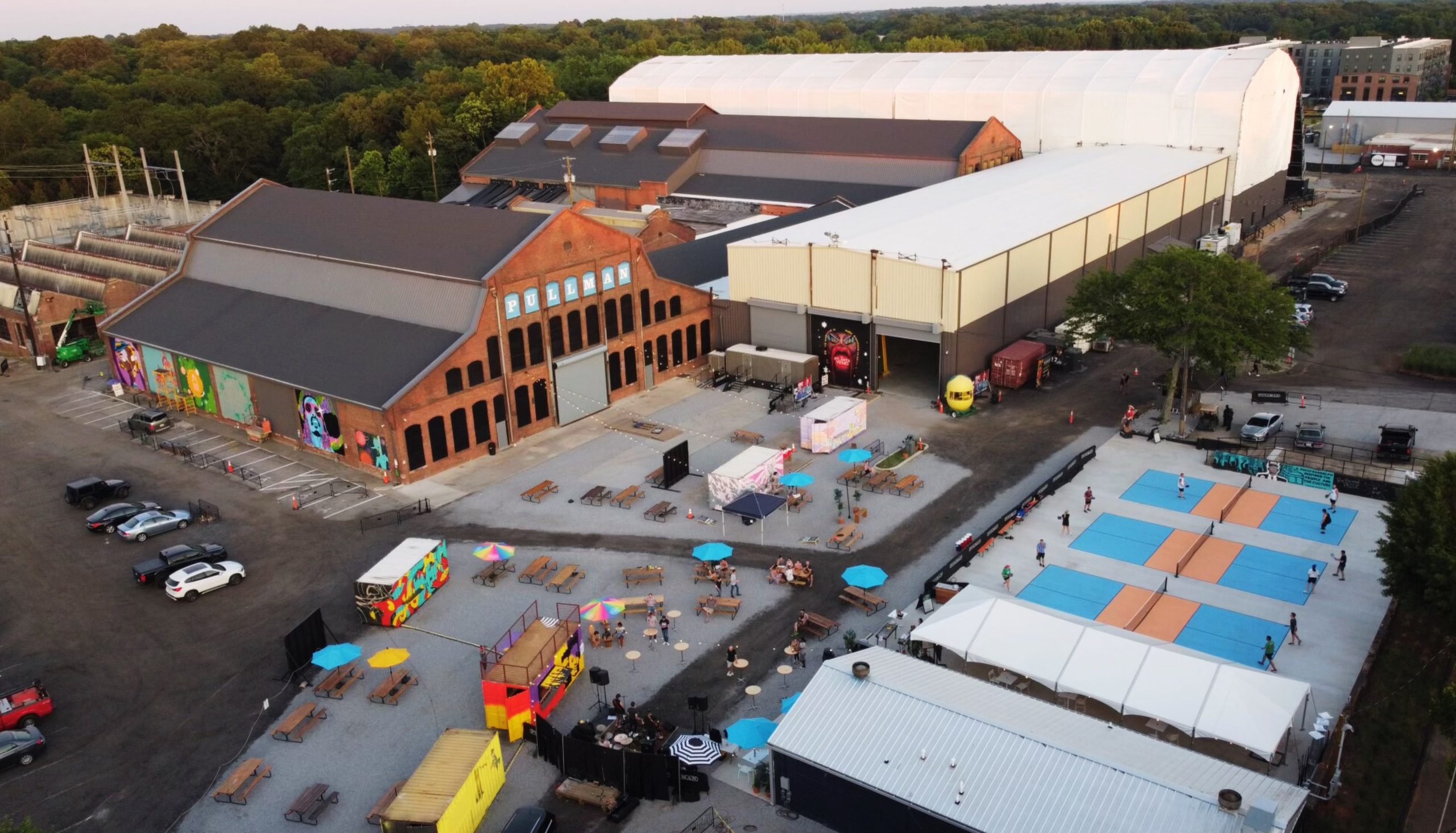 An aerial photo of Pullman Yards in Atlanta, the site of Atlanta Art Fair 2024, with several adjacent warehouses.