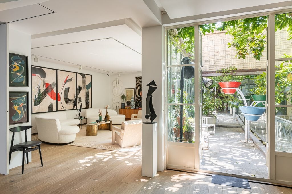 A bright living room next to a sunlit terrace