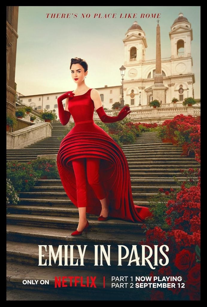 The promo image for the fourth season of Emily in Paris, with Emily Cooper, a young white woman with dark hair played by Lily Collins, on the Spanish Steps in Rome in a fashionable sleeveless layered red dress with a long train and a short front over tight red pants, with matching elbow length gloves. There are red flowers on the steps.. 