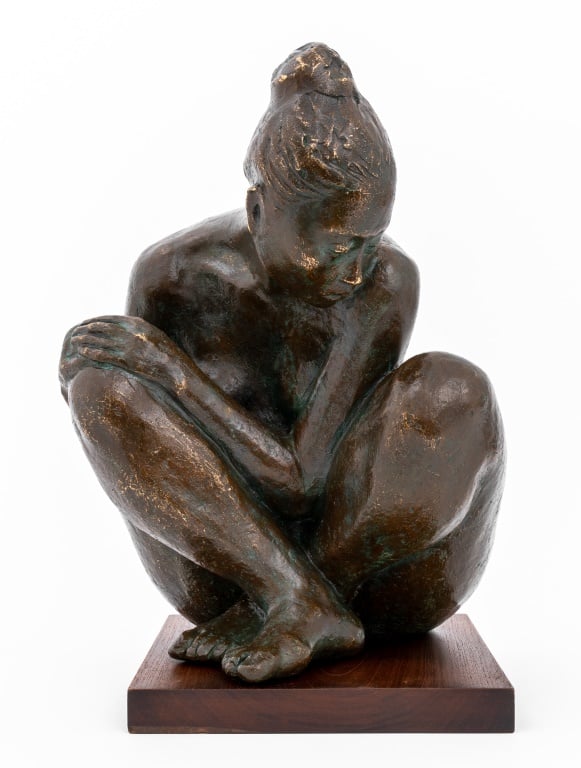 A bronze sculpture of a crouching woman by Francisco Zuniga in Showplace's Auction top lots.