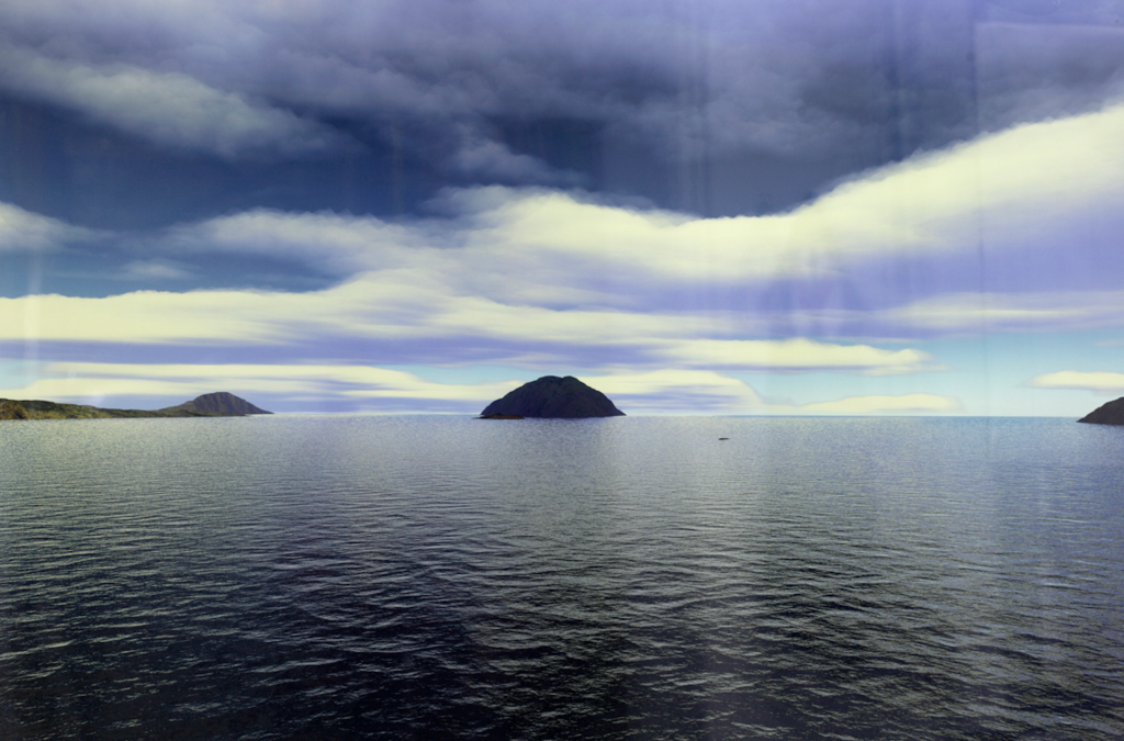 A seascape with islands in the distance