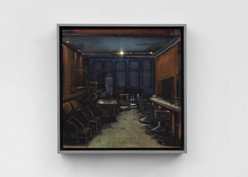 An interior view of an empty, dimly lit barbershop by artist Liu Jian.