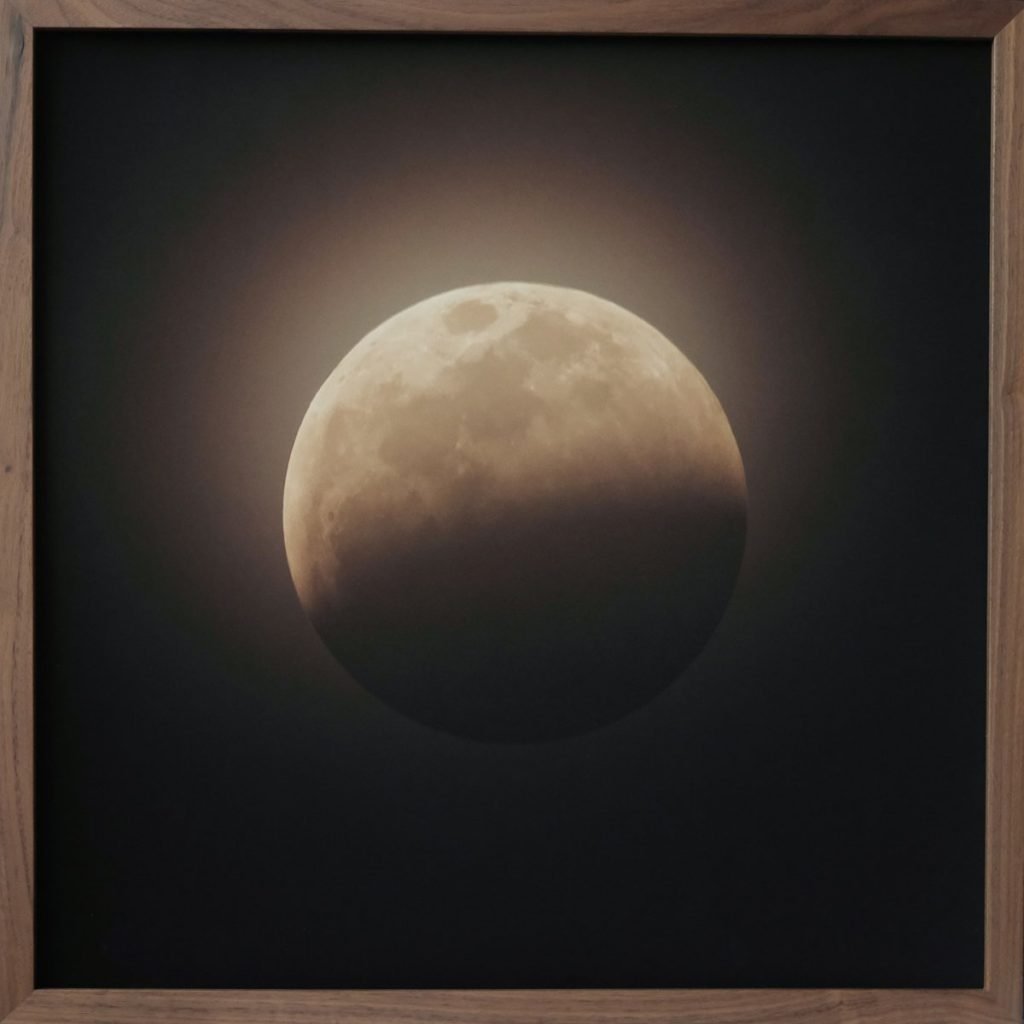 A sepia toned image of a partial lunar eclipse.