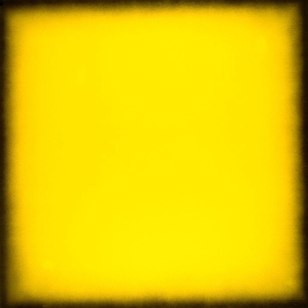 An abstract image of yellow with a fuzzy black border