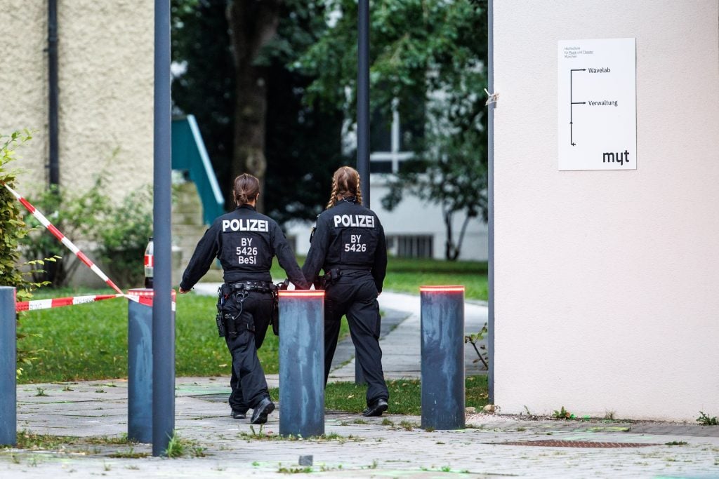 Two police officers seen from behind