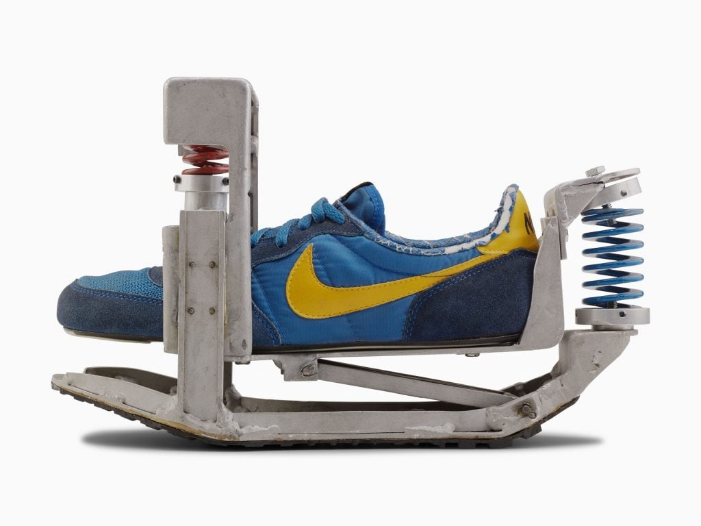 A Nike shoe outfitted with a spring shock absorbing mechanism