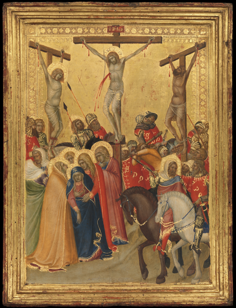 A photo of a framed painting in the Siena Renaissance style depicting three figures on the cross, Christ at Center, while the Virgin Mary and his followers watch on.