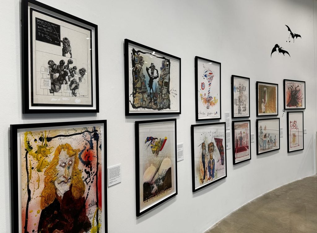 A gallery wall hung with hand-drawn portraits by Ralph Steadman