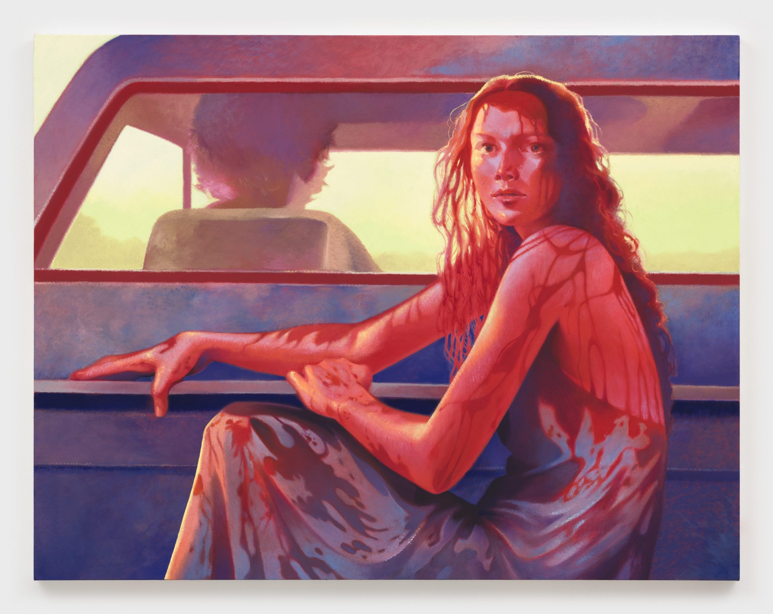 a young woman in a blue dress sits in the back of a pickup truck