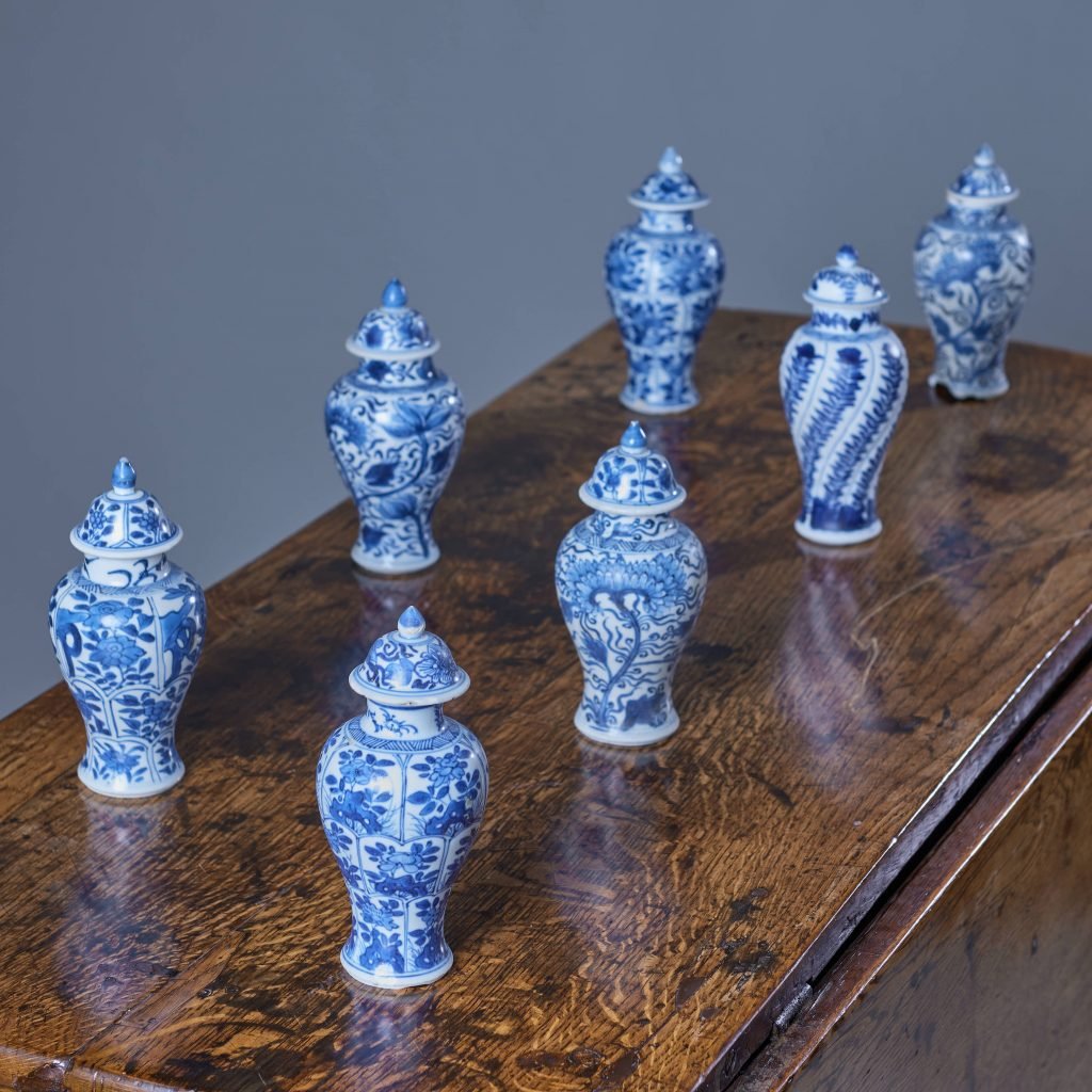 blue and white vases on a wooden table