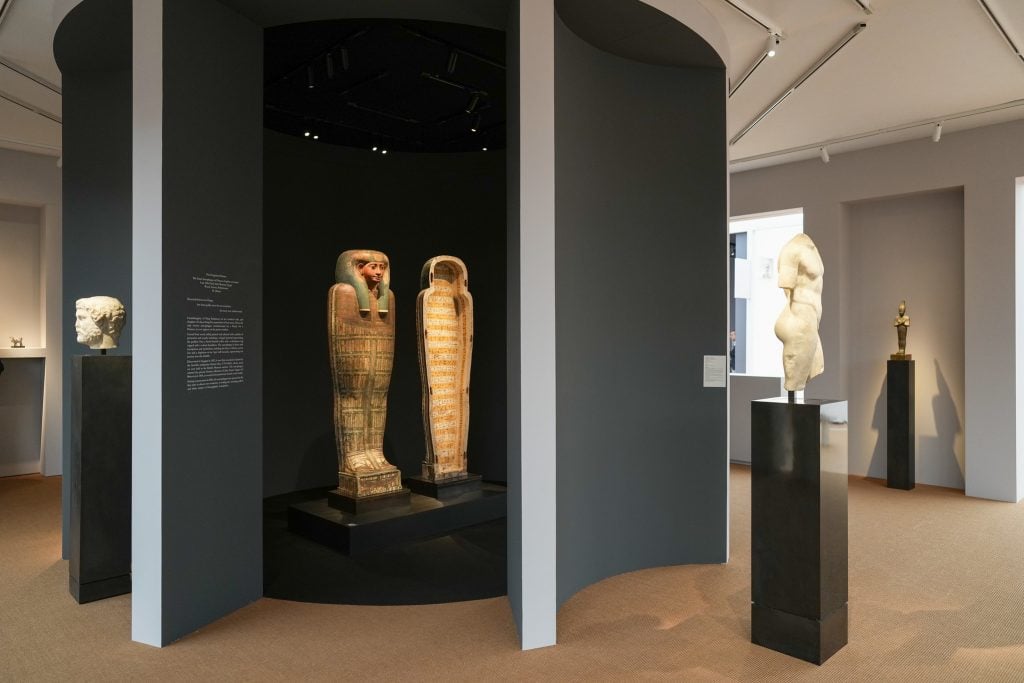 An Egyptian sarcophagus on display in a gallery booth at Frieze Masters 2024