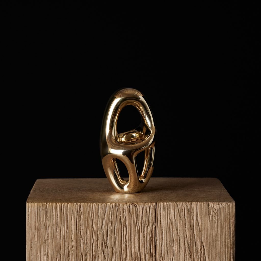 A vermeil version of the Ptolomee II, Celine's rendition of the Jean Arp sculpture, in silver, contained within a pine box